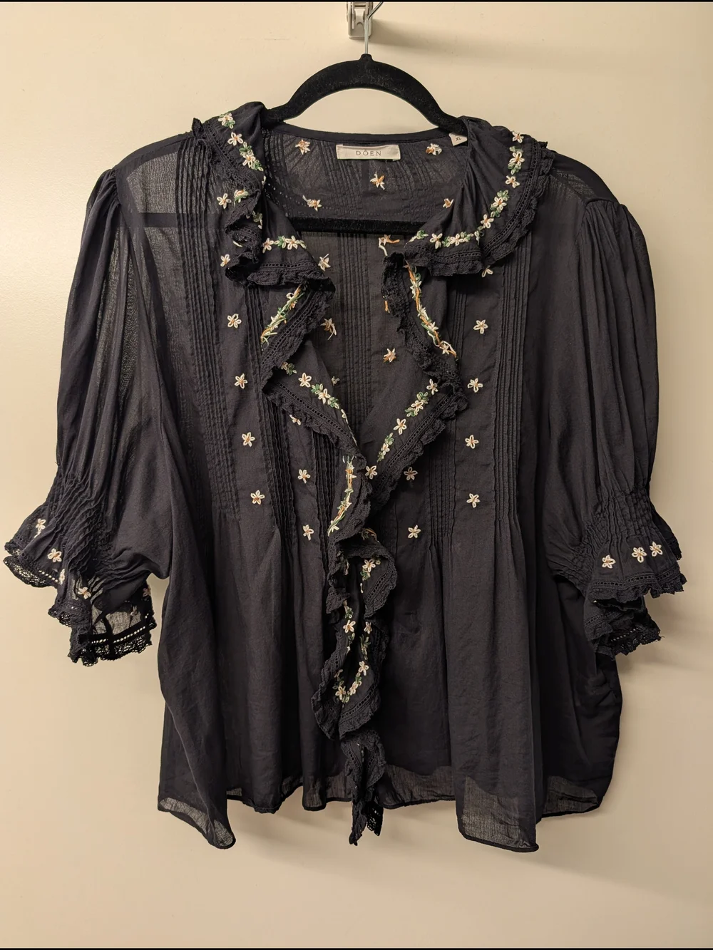 Doen Hettie Black Ruffled Blouse with White & Green Floral Trim